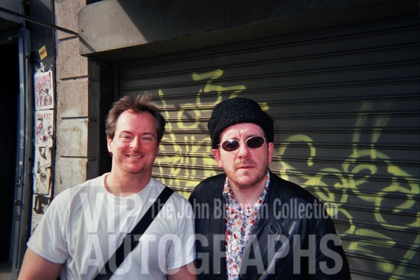 Elvis Costello Photo with Authentic Autograph Dealer John Brennan Elvis Costello Photo with Authentic Autograph Dealer John Brennan